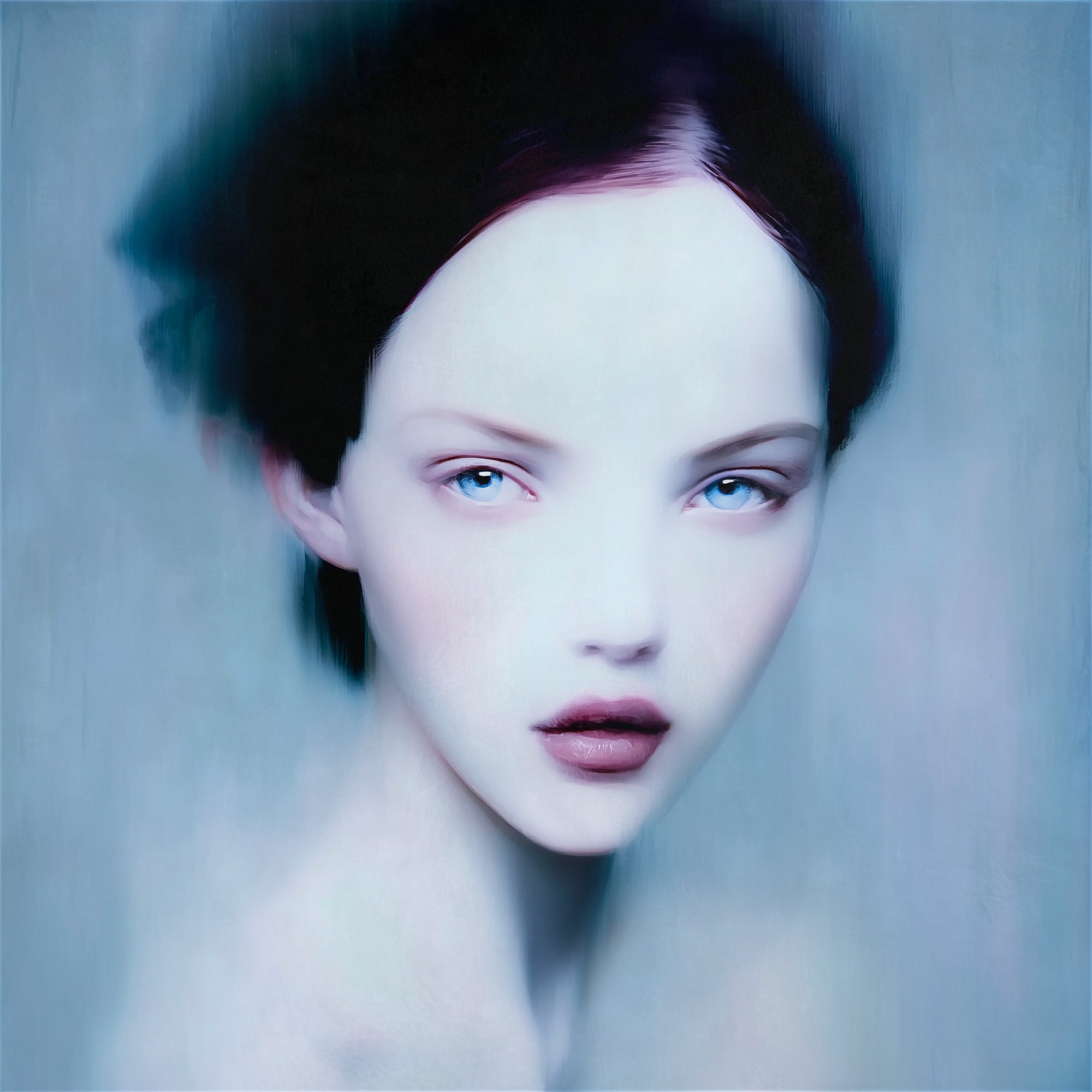 “MEETH 017” by Giuseppe Scarangelli, mixed media on aluminium panel, 150×150 cm, 2025. A large-scale contemporary portrait depicting a young woman with an ethereal, almost translucent complexion. Her features are softly rendered with delicate shading, while blurred contours around her hair and shoulders create a sense of motion and dreamlike atmosphere. The composition uses cool blue, violet, and muted grey tones, contrasted by dark details framing the face. The work blends realism with abstraction, giving the figure a haunting, otherworldly presence.